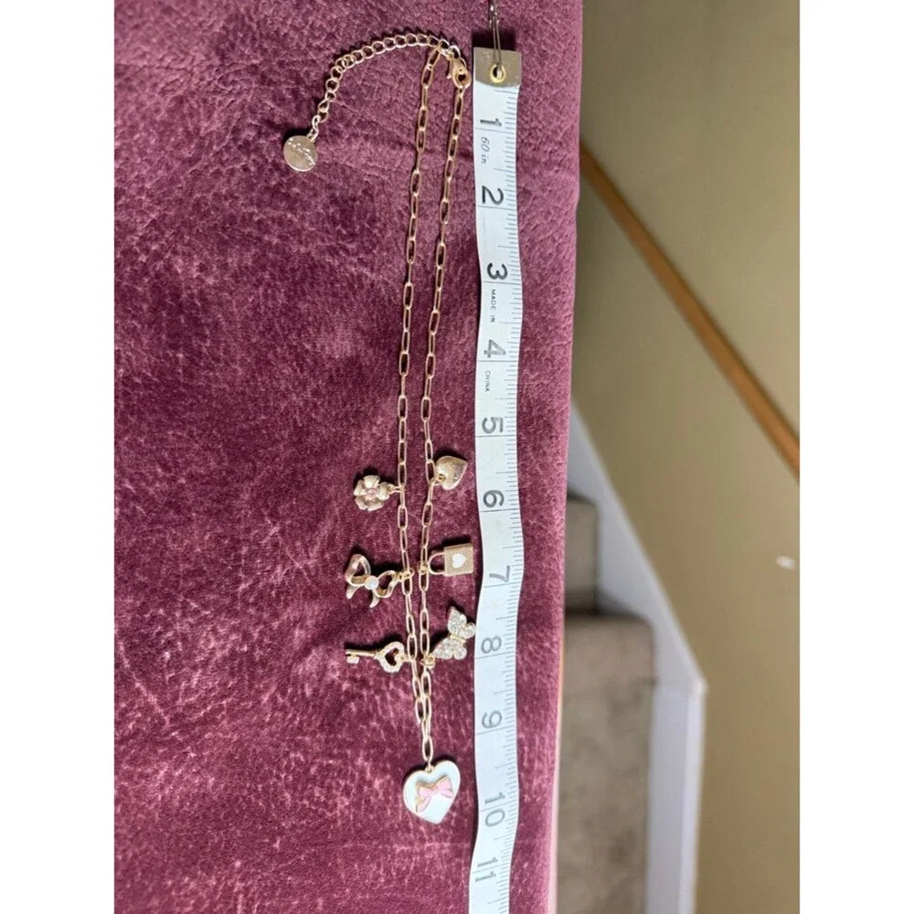 Packed Party Gold-Tone Heart & Charm Necklace with Pink Bow Accent